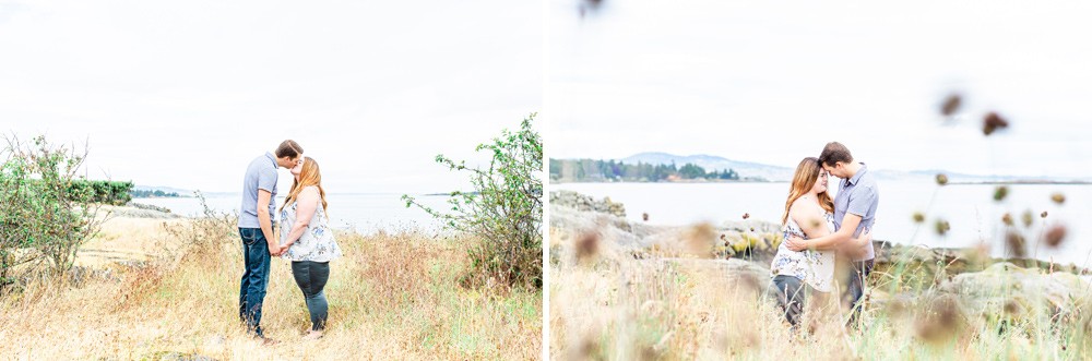 couple in tall grass in front of the ocean on vancouver island